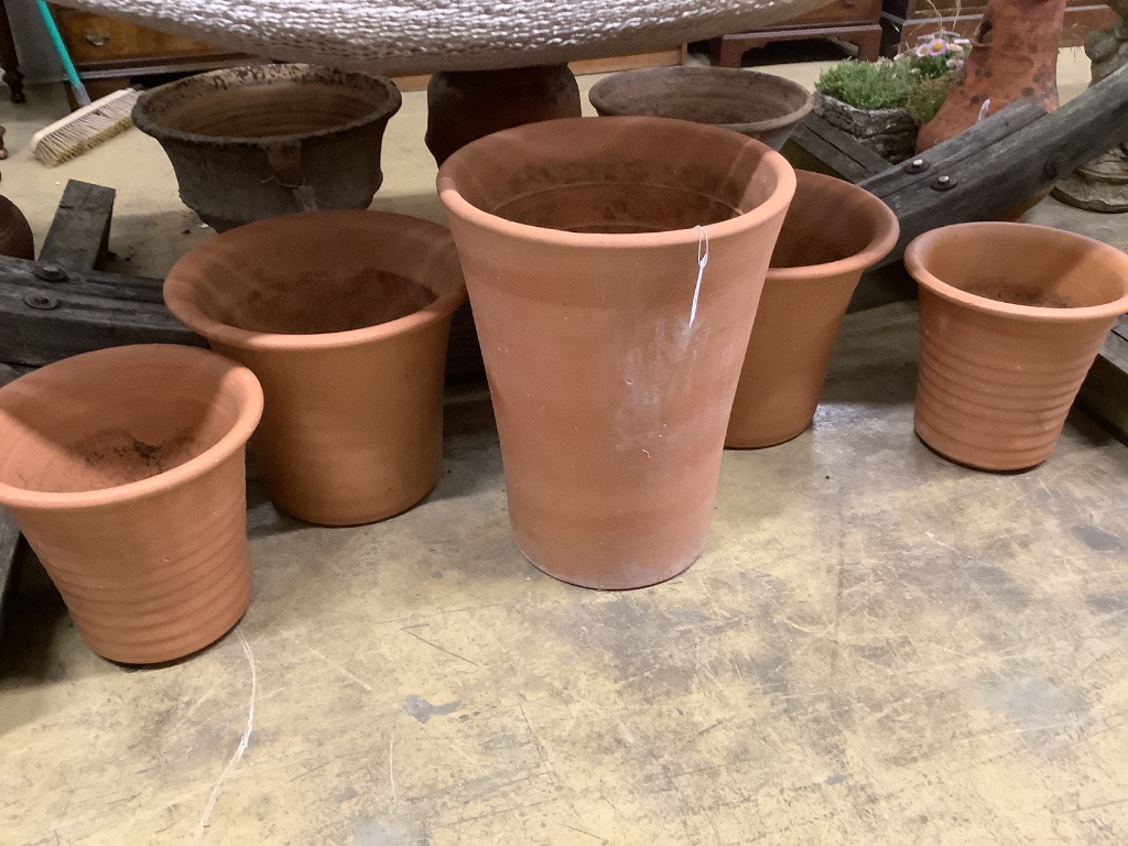 Five (two pairs and a single) circular terracotta garden planters, largest 40cm diameter, height 53cm